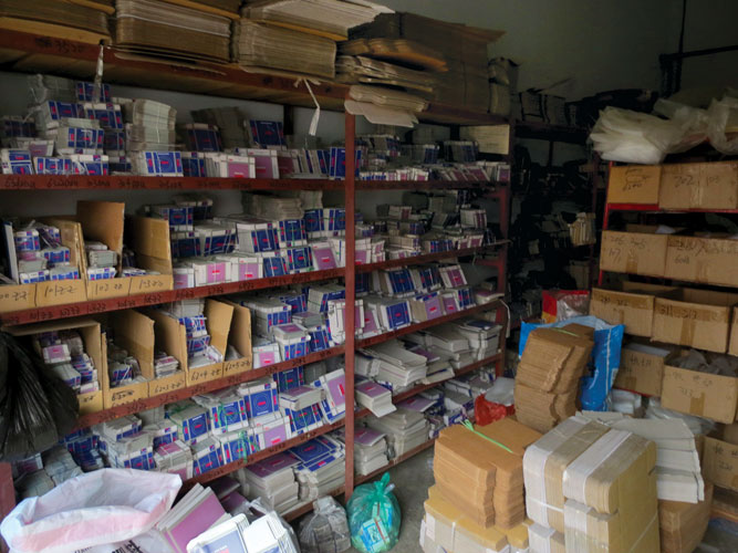 Shelves filled with fake NSK bearing boxes